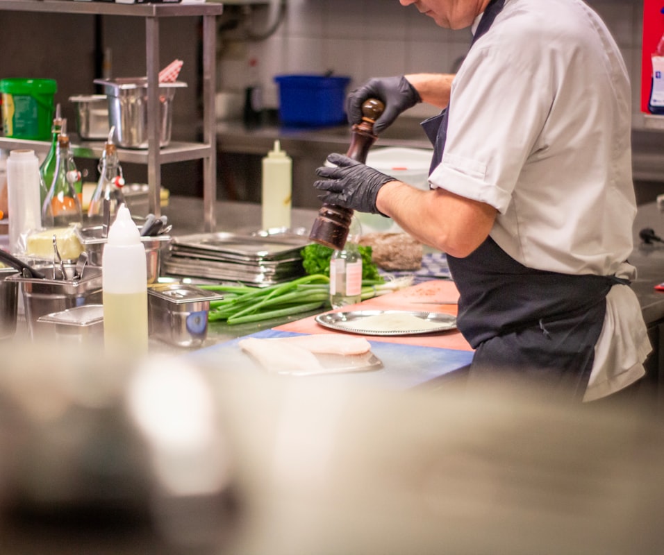 Instructor demonstrating cooking technique in live class